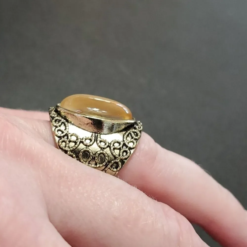 Gold tone ring with stone